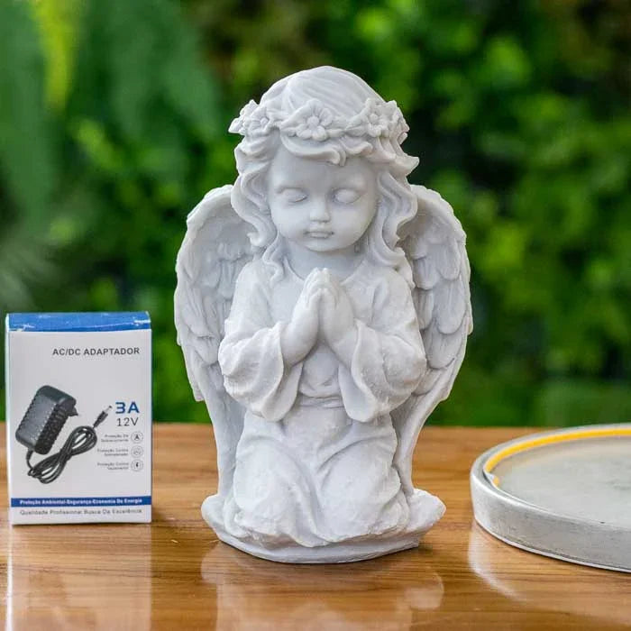 Peça espiritual em marmorite com anjo em prece e luz embutida