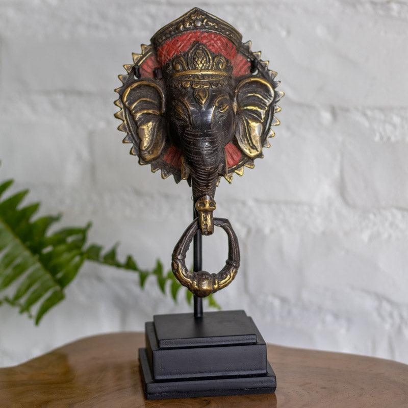 Escultura Ganesh Face em bronze com base artesanal feita em Bali.