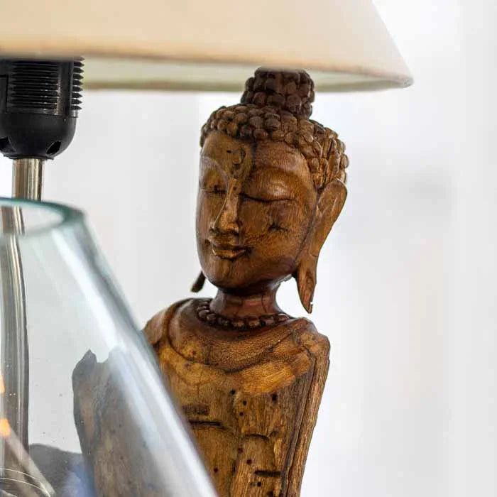 Abajur no tronco com Buddha entalhado e terrário em vidro soprado.