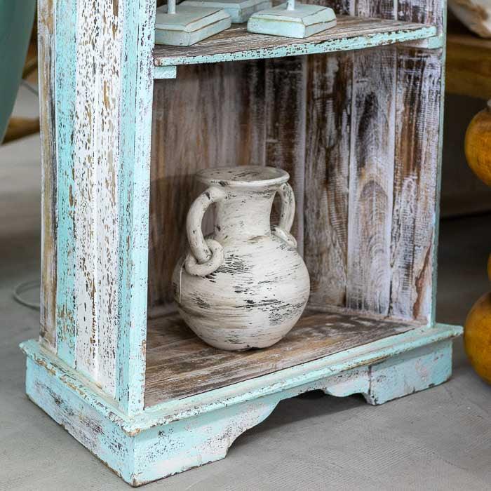 Estante barco feita à mão em Bali com acabamento envelhecido, design curvo em madeira natural que reflete o espírito artesanal da ilha.