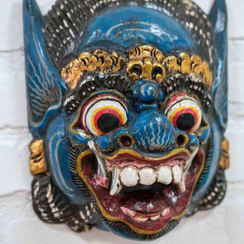 Máscara decorativa Barong azul em madeira entalhada artesanal.