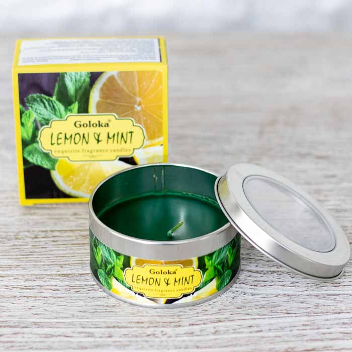 Vela perfumada de 70g em recipiente de metal para aromaterapia e cantos de meditação.