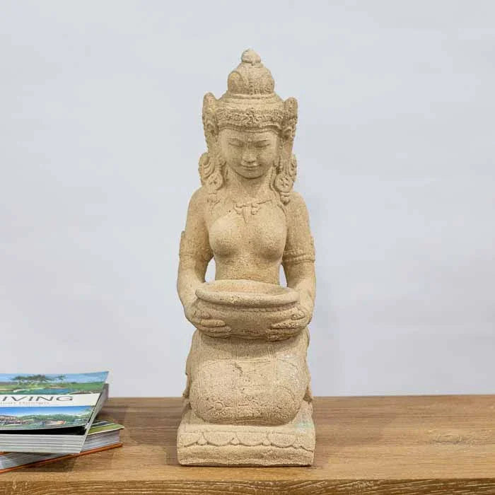 Deusa Dewi Sri ajoelhada, símbolo hindu de abundância, para decoração zen. 