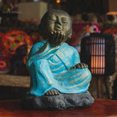monge sentado roupa azul mandando beijo decorativo decor decoracao zen budista budismo bali balines fibrocimento zen decor